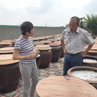 Prof. Angela Ki Che Leung interviewing owner of traditional soy sauce manufacturing house in Xiluo, Taiwan (April 2019)