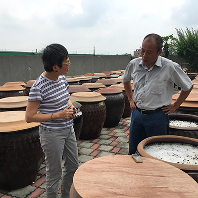 Prof. Angela Ki Che Leung interviewing owner of traditional soy sauce manufacturing house in Xiluo, Taiwan (April 2019)
