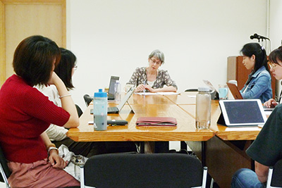 Prof. Ellen Hertz with students in discussion